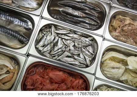 Photo of the showcase with seafood with the located fish in the center