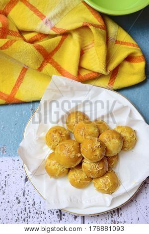 Nastar or Indonesian pineapple tart cookies topped with grated cheese