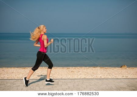 Jogging In Th Beach - Woman Runns Near Sea On Early Summer Morning