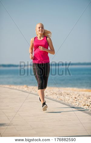 Jogging In Th Beach - Woman Runns Near Sea On Early Summer Morning