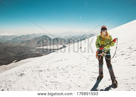 Woman alpinist mountain climbing glacier Travel Lifestyle endurance concept adventure active vacations outdoor mountaineering sport