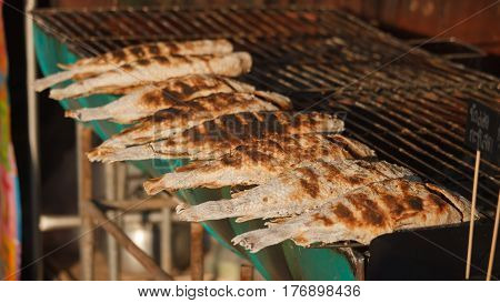 Charcoal griiled salt grilld fish barbecue Thai street food