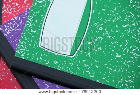 Colorful Composition Notebooks Arranged on a Desk