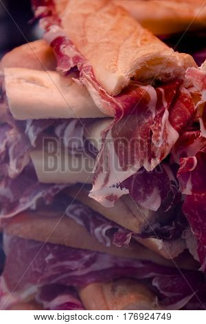 Mountain of Iberian pork ham sandwiches. No people