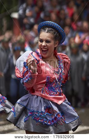 ORURO, BOLIVIA - FEBRUARY 25, 2017: Caporales dancer in ornate costume parading through the mining city of Oruro on the Altiplano of Bolivia during the annual carnival.