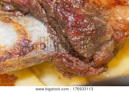 Roasted veal ribs? close-up. Rack of roasted lamb meat