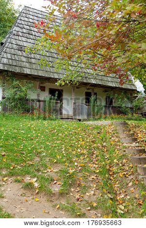 photo of beautiful view of village house on the wonderful trees background