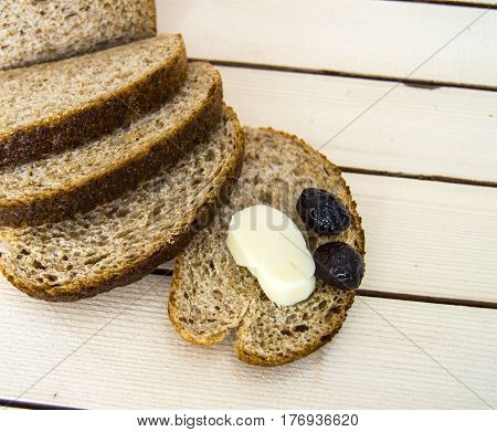 Bran bread and besides black olives, cheese, the most beautiful breakfast cheese and black olives.In different concepts bread, olive and cheese pictures,