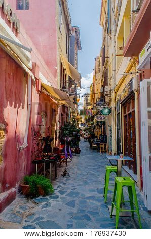 Chania, Greece - July 17, 2013: the Narrow old street with walking tourists