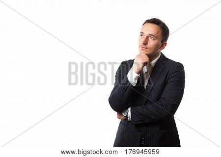 attractive young man in a suit on a white background thinking