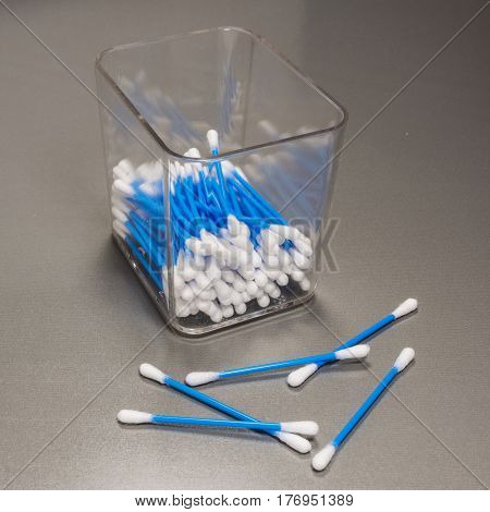 Cotton swab in a box on a wooden background