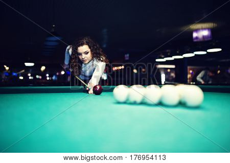 Young Curly Girl Posed Near Billiard Table. Sexy Model At Black Mini Mini Skirt Play Russian Snooker