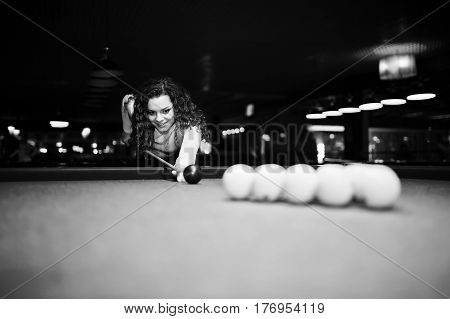 Young Curly Girl Posed Near Billiard Table. Sexy Model At Black Mini Mini Skirt Play Russian Snooker