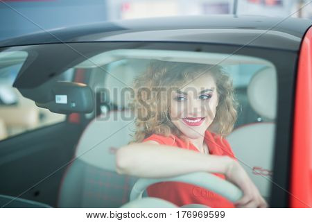 Front View Of Woman Driving Microcar