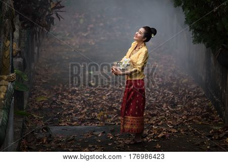 Laos woman in lao traditional dress standing