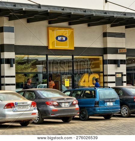 Shopping Center And Cars. Mtn Group Office. Vehicles In A Parking Lot. Yellow Signboard. Shopping Ma