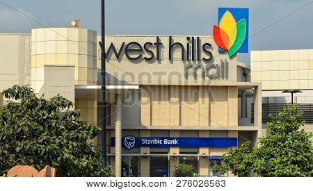 Signboard On Building Of West Hills Mall. African Shopping Center. Branch Of Stanbic Bank. Modern Ur