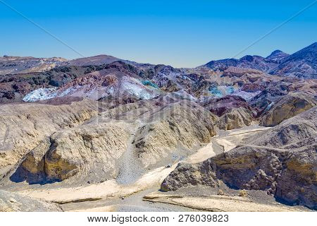 Scenic Road Artists Drive In Death Valley With Colorful Stones, Hills  With Minerals, Blinking Color