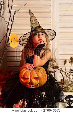 Little Girl Play Childhood Games On Halloween. Early Childhood. Little Girl With Halloween Pumpkin. 