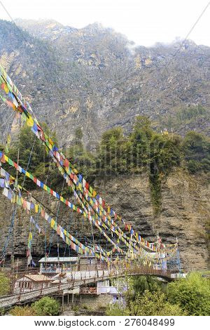 Hanging Bridge To Village Of Chame At The Annapurna Circuit, Nepal
