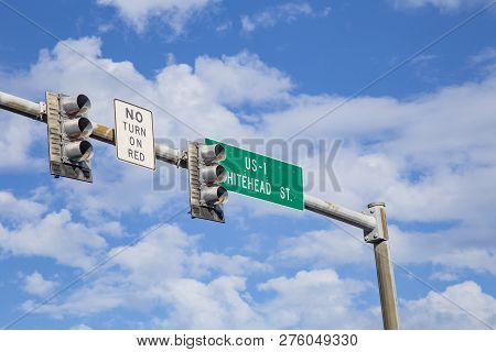 Beginning Of Us 1 Highway In Key West At Whitehead Street Under Blue Sky With Traffic Light