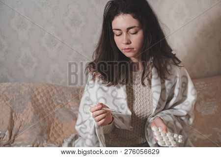 The Girl Puts A Pill On Her Tongue And Prepares To Drink Water.