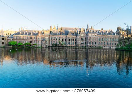 Facade Of Binnenhof - Dutch Parliament With Reflections In Hofvijver Pond, The Hague, Holland