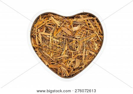 Catuaba Bark Tea In Heart Shape, Isolated. Natural Herbal Tea From Powdered Catuaba Tree Bark. Brazi