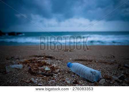 Trash, Plastic, Garbage, Bottle... Environmental Pollution On The Beach. Royalty High-quality Free S