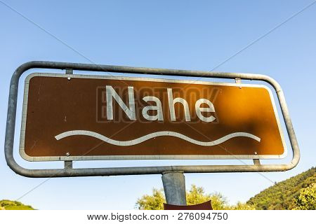Sign River Nahe Under Blue Sky With Wave Symbol And Brown Color As Touristic Scenic Spot