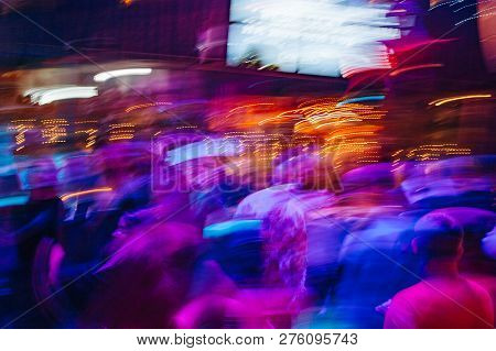 Dancing People In A Disco, Nightclub. People Relaxing And Having Fun. Blur Photo. Long Shutterspeed