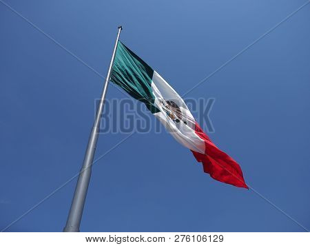 Beauty National Maxican Flag On Beach At Bay Of Pacific Ocean In Acapulco City In Mexico With Trees 