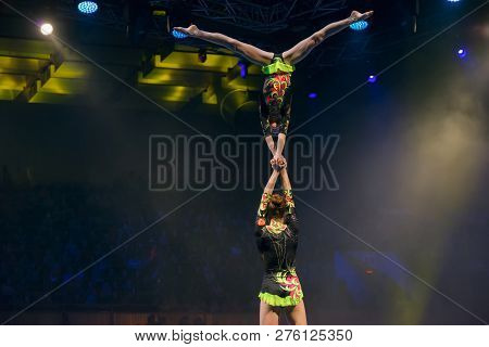 Moscow, Russia - November 16-17, 2018: Acrobats Daria Tikhomirova, Inna Yumashev And Sophia Polishch