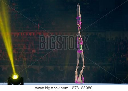 Moscow, Russia - November 16-17, 2018: Acrobats Daria Tikhomirova, Inna Yumashev And Sophia Polishch