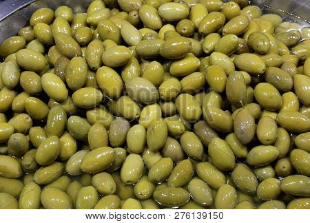 Green Freshly Picked Olives In Brine For Sale At The Italian Food Stand In South Italy