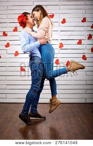Young Happy Couple With Heart In Hands Onbackground