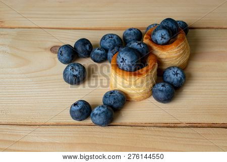 Blueberries With Baskets Of Dough Close-up On The Wooden Background
