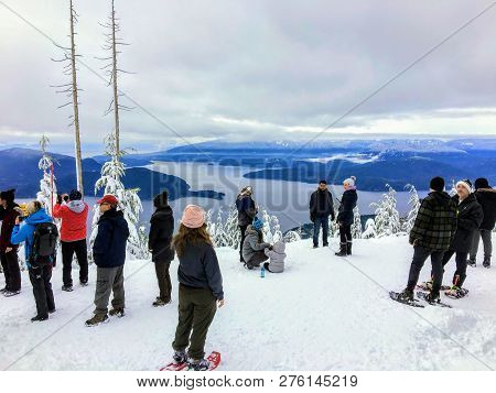 Cypress Mountain, British Columbia, Canada - December 27th, 2018: A Group Of Snowshoers Admiring The