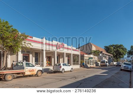 Clanwilliam, South Africa, August 28, 2018: A Street Scene, With Businesses, Vehicles And People, In
