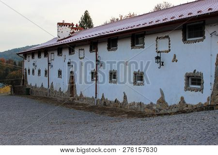Typical Village House With Small Windows Covered With Stones