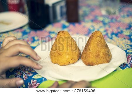 Two Coxinhas (brazilian Chicken Croquettes) On A Plate In Brazil