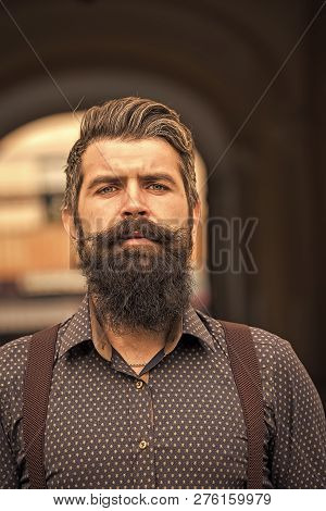 Closeup View Of One Handsome Senior Stylish Man With Black Hair And Long Lush Beard In Blue Shirt St