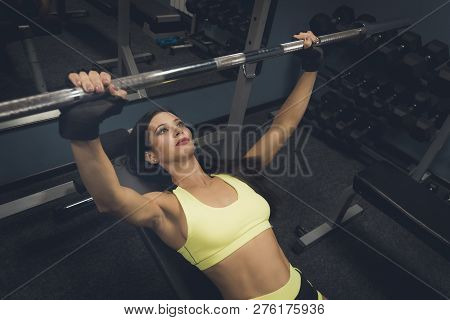 Close Up Of Sporty Girl Doing Exercises In Gym. Active Lifestyle Of A Female Bodybuilder. Beautifuil