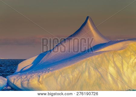 Antarctic Sunset: Floating Icebergs In The Weddell Sea, Near The Antarctic Peninsula, As Seen From A