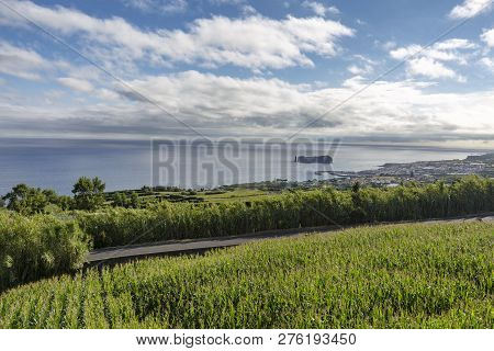 A Corn Field With Vila Franca Do Campo And The Islet Of Vila Franca Do Campo In The Distance.