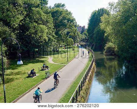Park Near The Canal With A Path For Cyclists And Runners, Europe, Italy,        Cernusco Sul Navigli