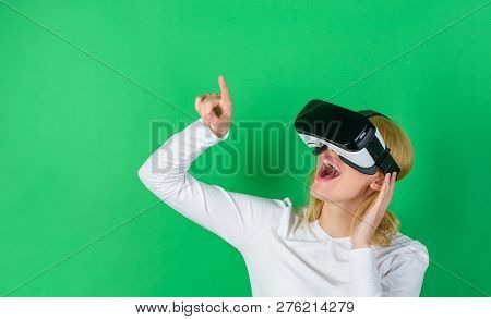 Amazed Young Woman Touching The Air During The Vr Experience. Woman Watching Virtual Reality Vision.