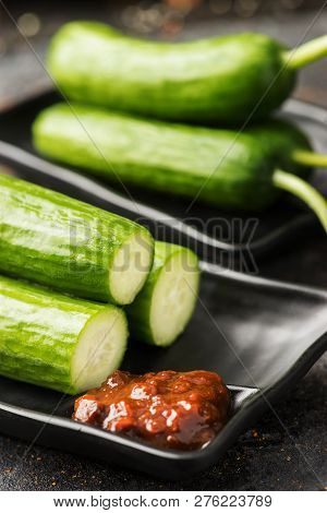 Small Cucumber With Soybean Paste In A Dark Dish