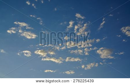 Distant View Of Stratocumulus Clouds On Blue Sky