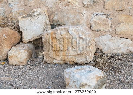 Al Jaya, Jordan, December 06, 2018 : A Fragment Of A Wall With A Pattern Carved On It Lies On The Gr
